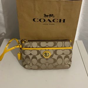 Coach wristlet yellow patent leather trim